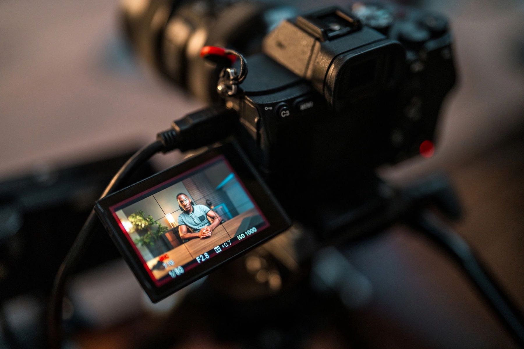 Camera viewfinder showing a business interview setup