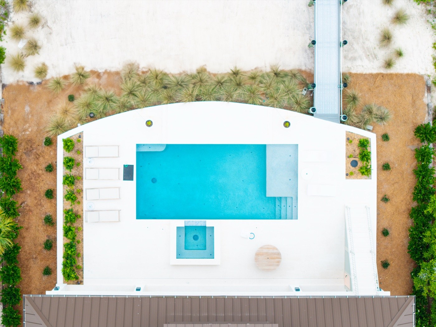 Top-down aerial view of a rectangular pool and spa, Ono Island