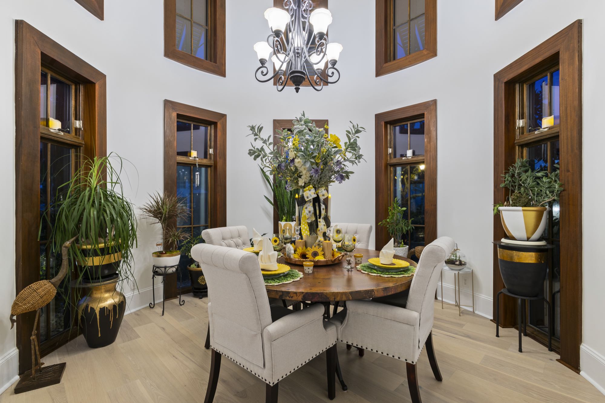 Formal dining room with chandelier and exposed brick archways