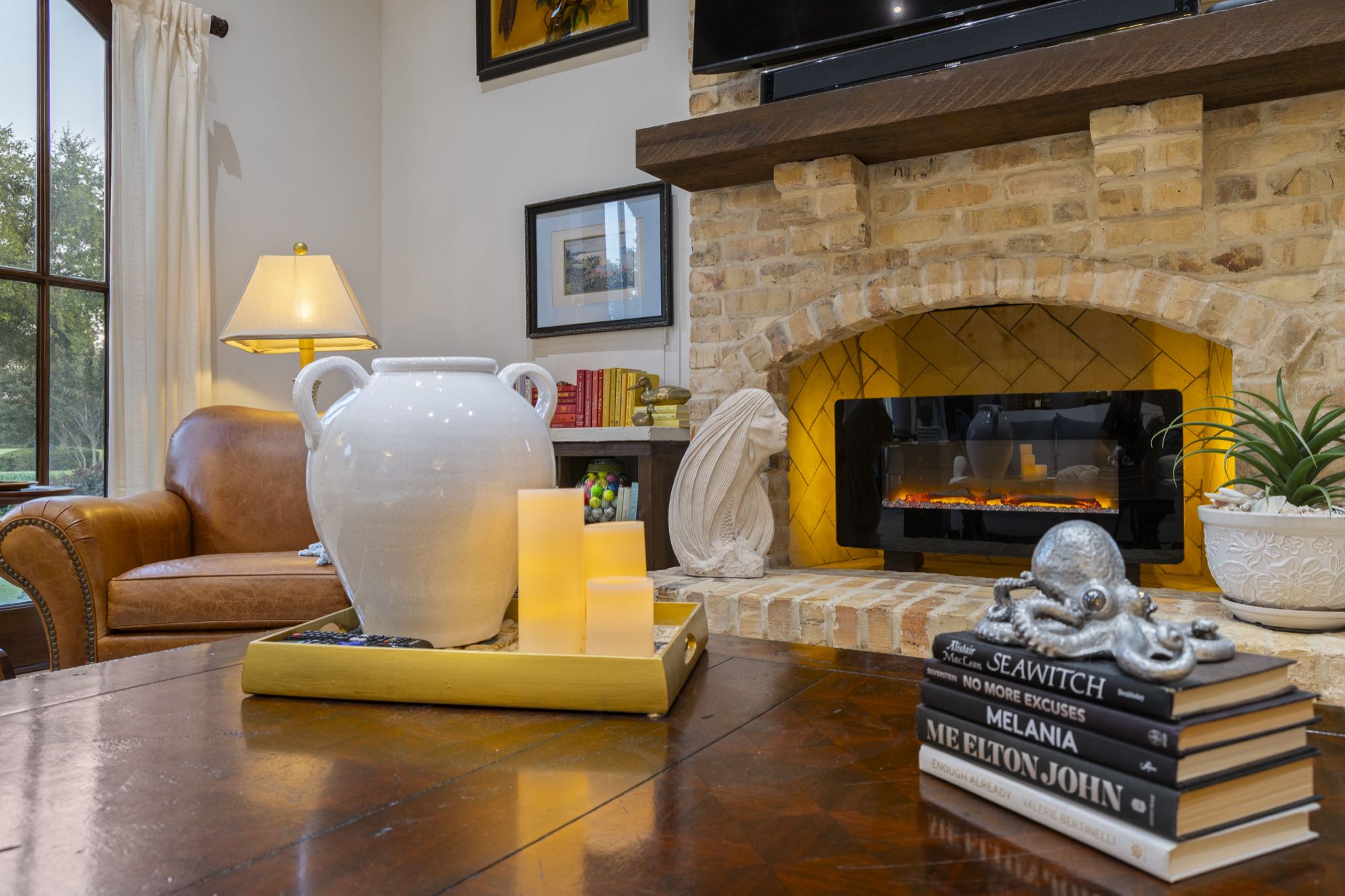 Cozy living room with stone fireplace and leather armchair