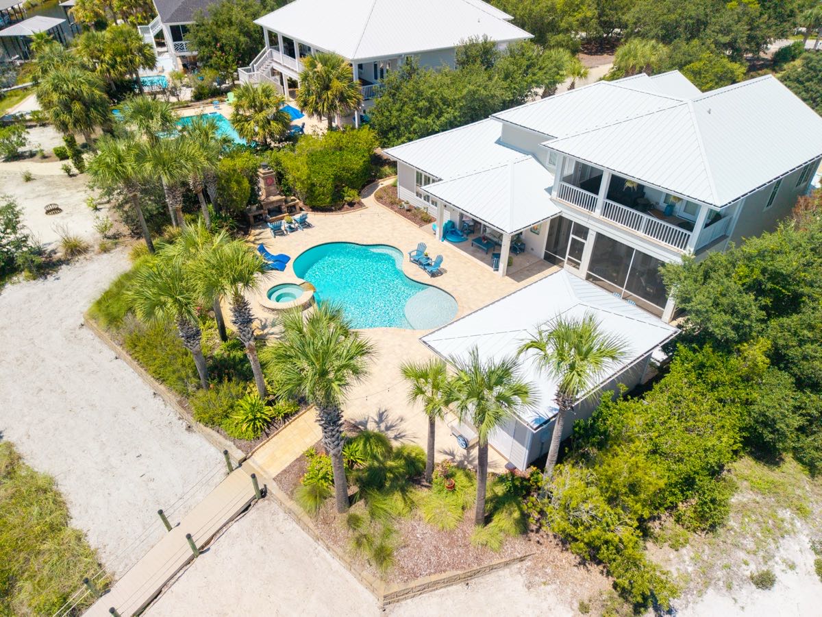 Top-down aerial view of a coastal home pool and courtyard