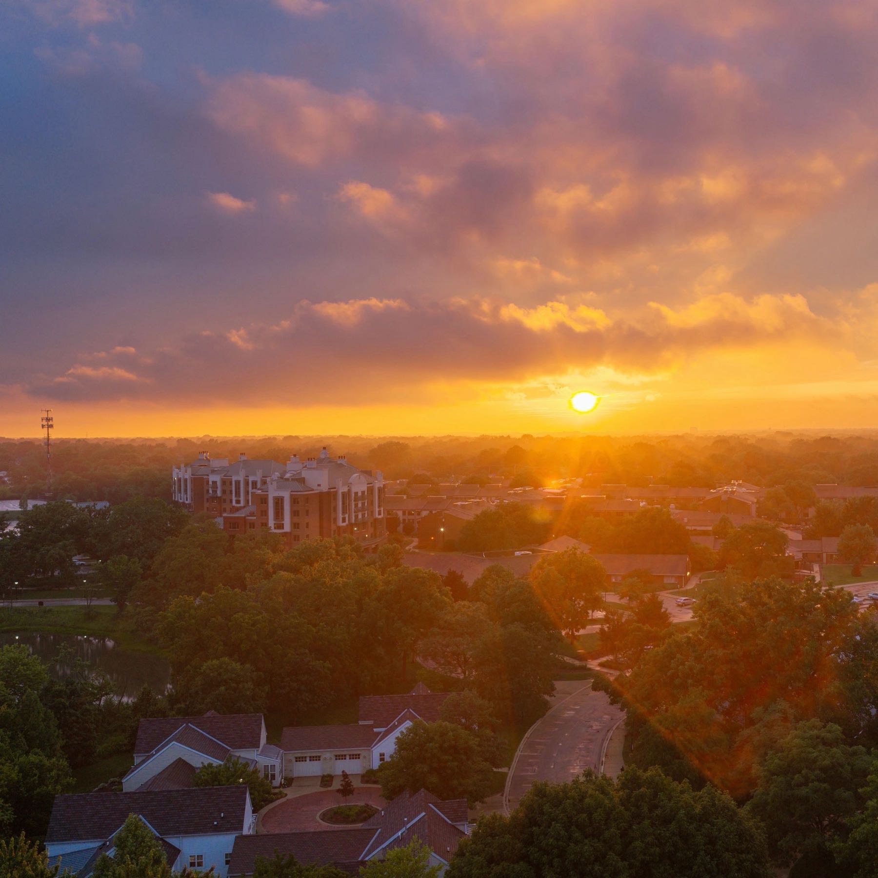 Aerial view of a neighborhood at sunset