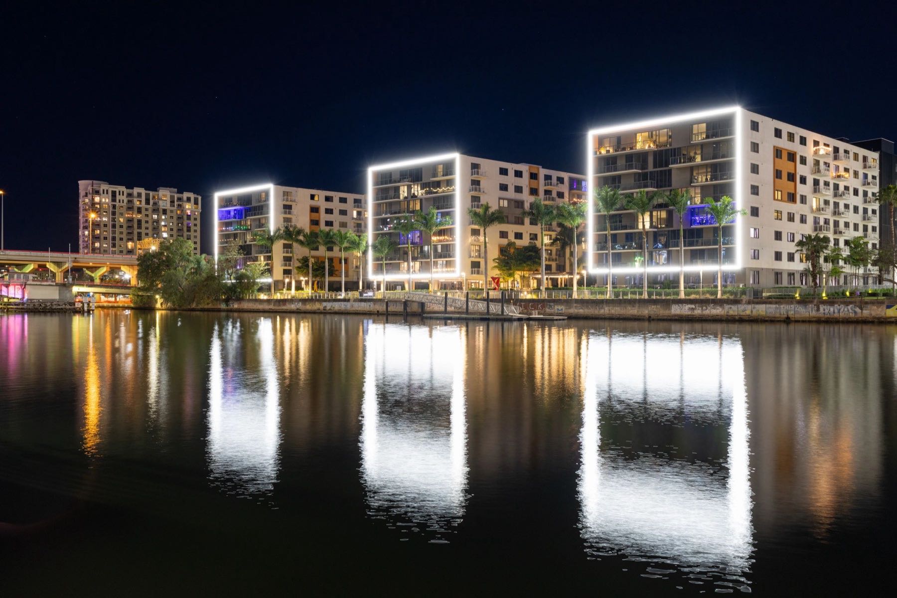 Waterfront condo towers lit up at night